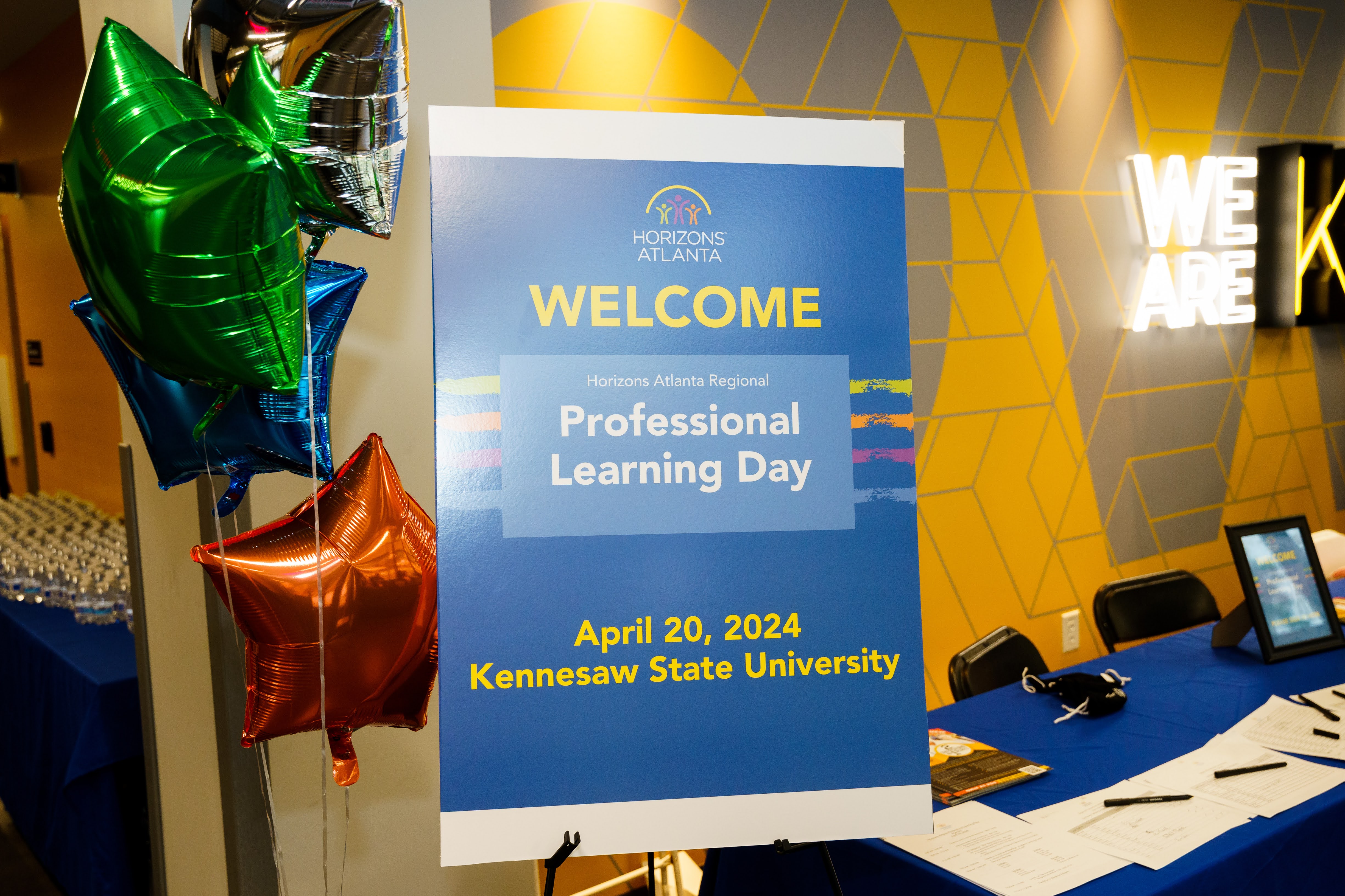 Event Sign that reads Horizons Atlanta Professional learning day next to balloons